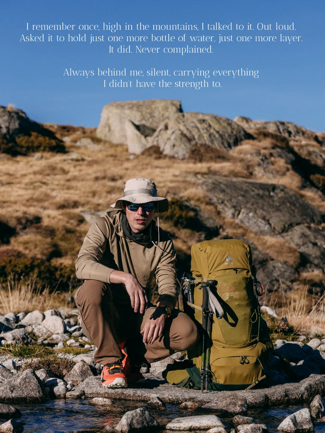 Olive Deuter trekking backpack standing on a rocky mountain trail