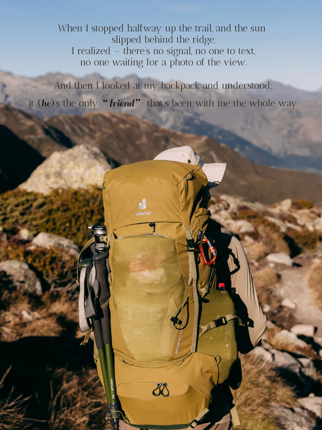Hiker crossing an alpine slope with an olive backpack
